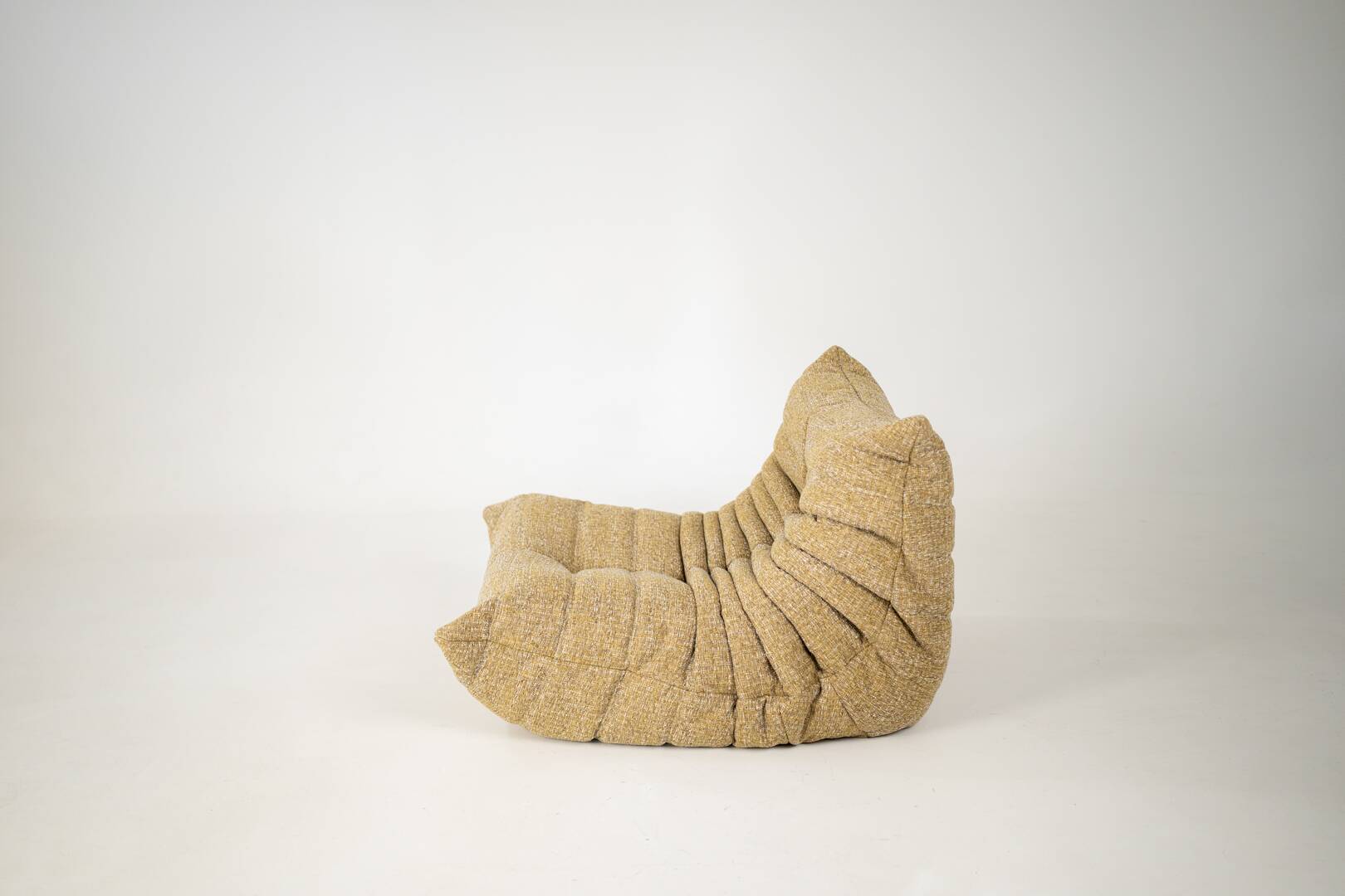 Togo set of launge chair and pouf in caramel loop