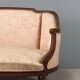 Antique neoclassical canapé in carved walnut from the 19th century.