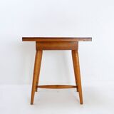 Vintage wooden side table with terracotta top