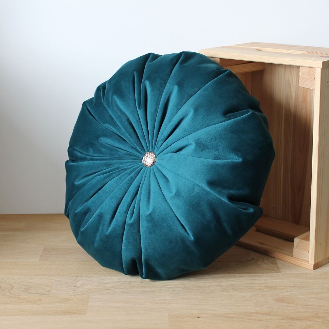 Turquoise round velvet cushion