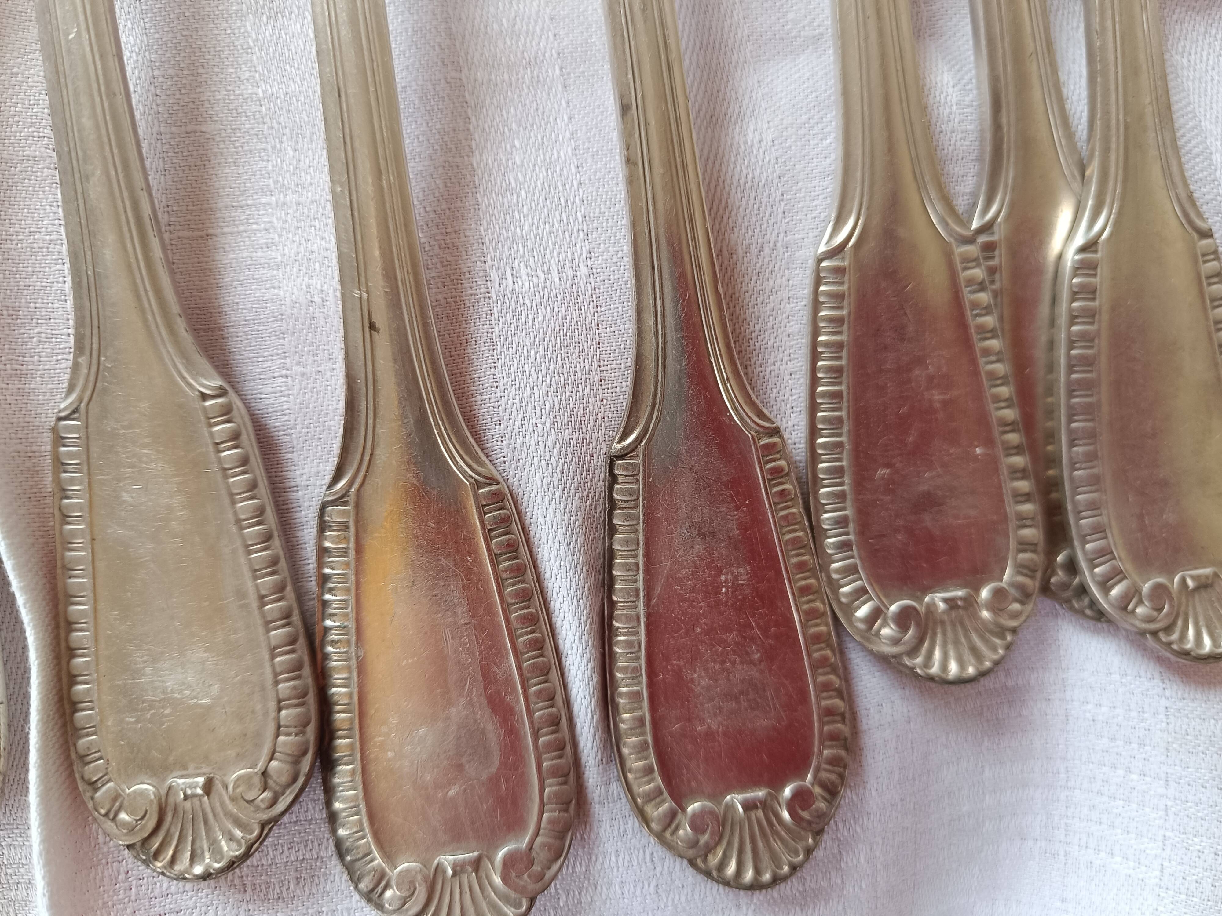 12 silver-plated forks. shell and pearls.