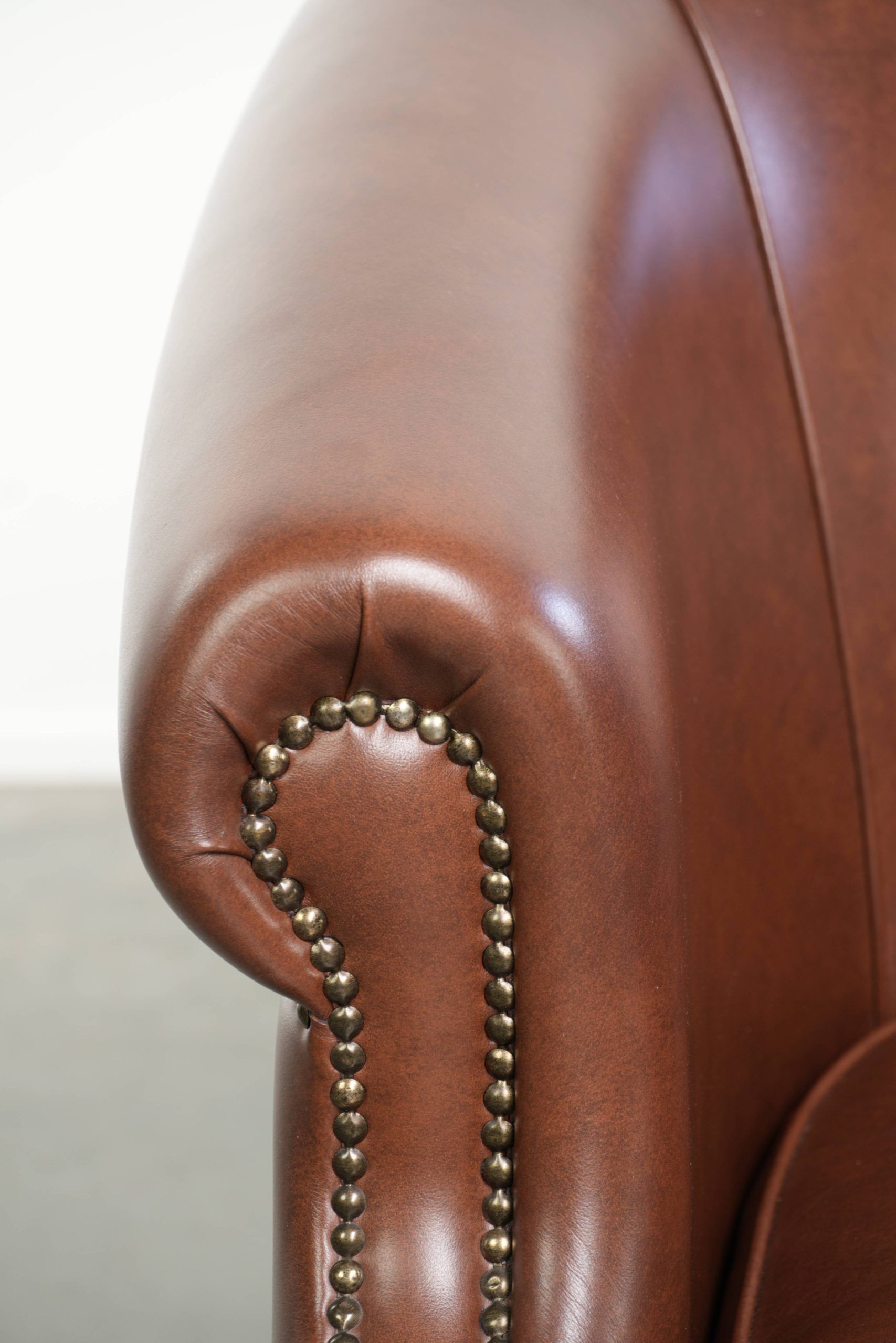 Cognac-coloured comfortable cow leather club armchair in English style