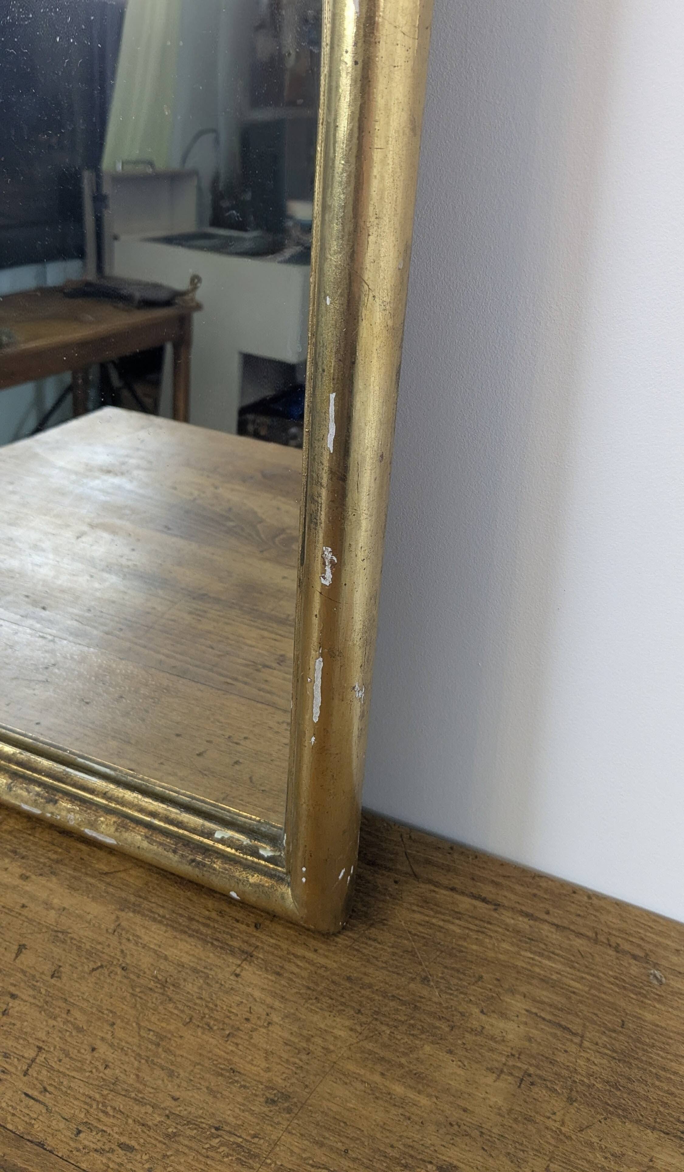 Antique gold mirror known as "gendarme's hat", patinated elegance 70 x 30 cm