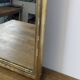 Antique gold mirror known as "gendarme's hat", patinated elegance 70 x 30 cm