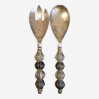 Old silver metal cutlery with blown glass beads