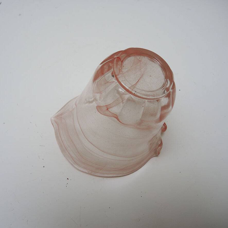 Antique blown glass vase in pink.