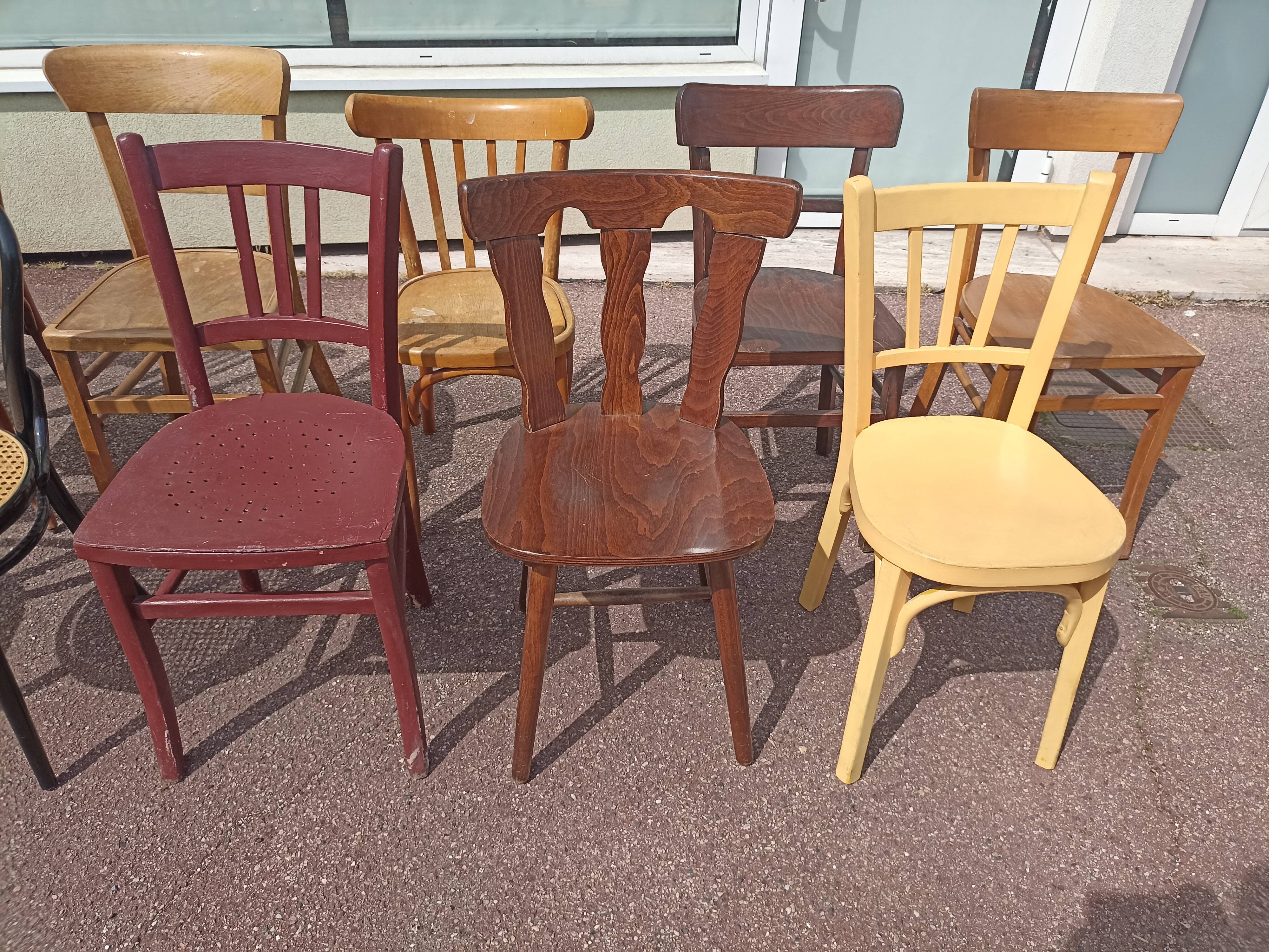 Set of 12 mismatched wooden bistro chairs