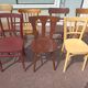 Set of 12 mismatched wooden bistro chairs