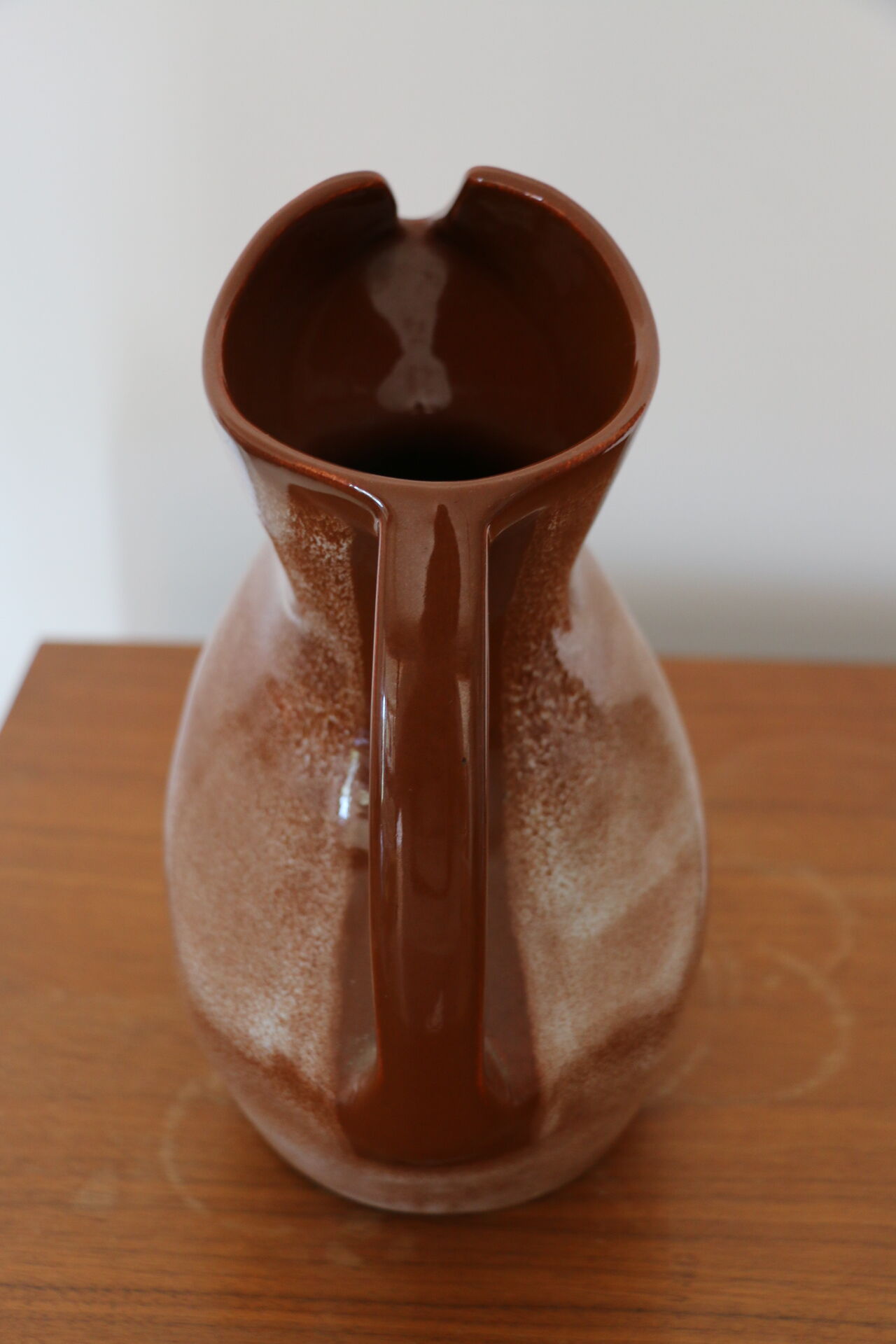 Brown painted earthenware pitcher