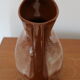Brown painted earthenware pitcher