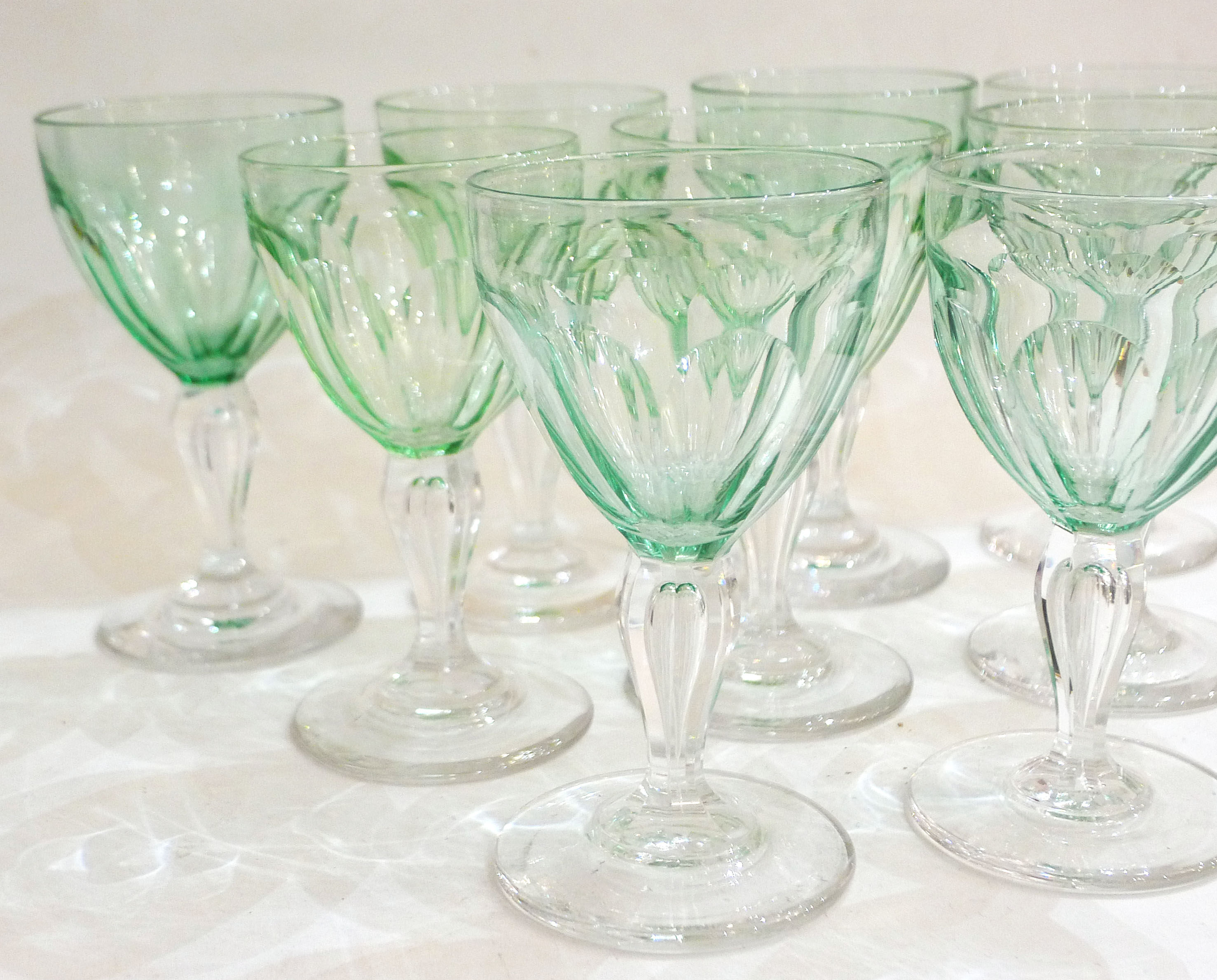 Set of nine glasses on foot in cut glass