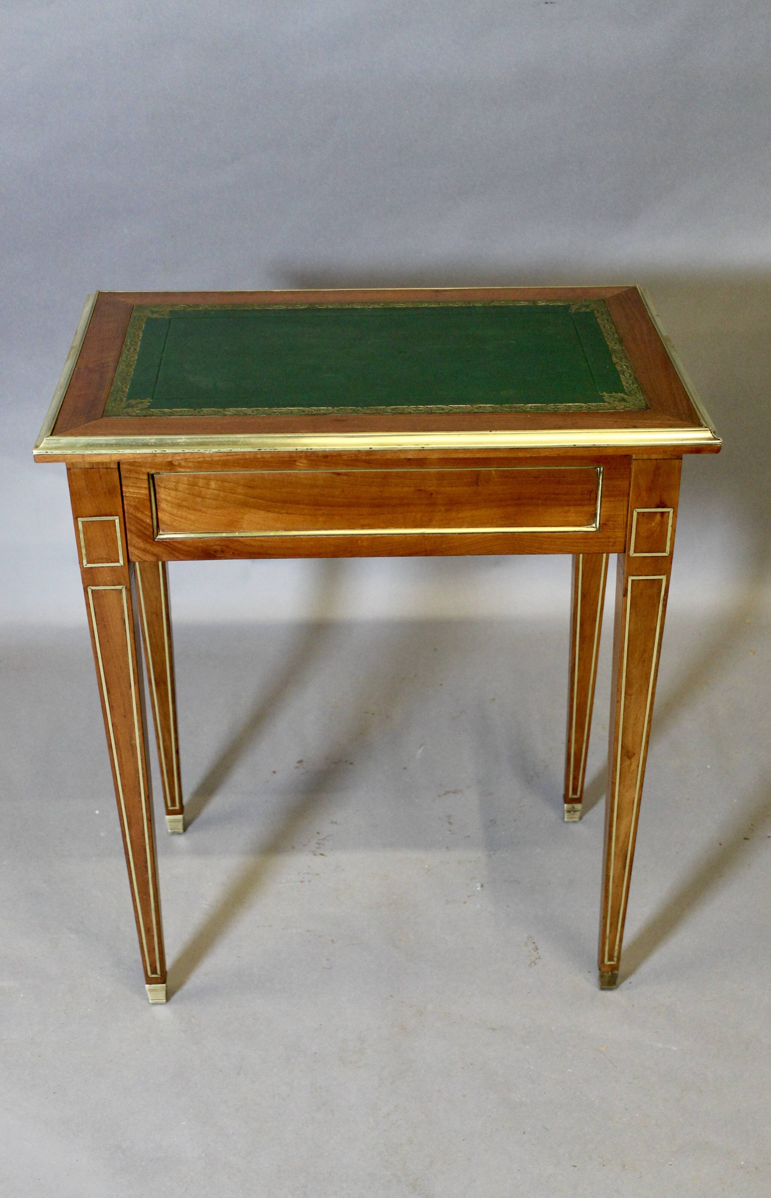 Louis XVI writing table with brass beading