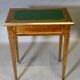 Louis XVI writing table with brass beading