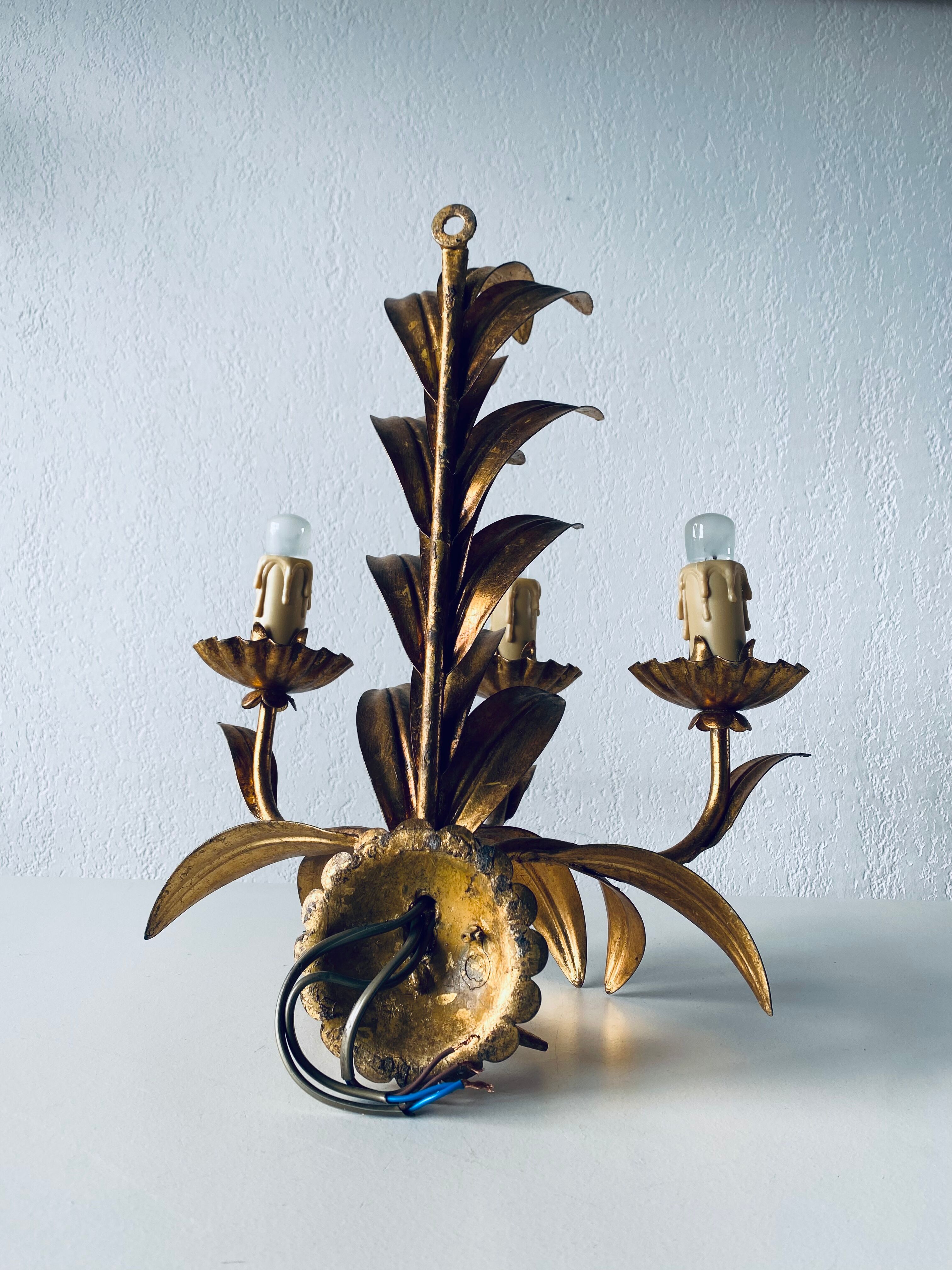 Golden leaf wall light