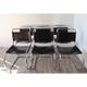 Series of 6 minimalist chairs in chrome metal and black leather around 1970
