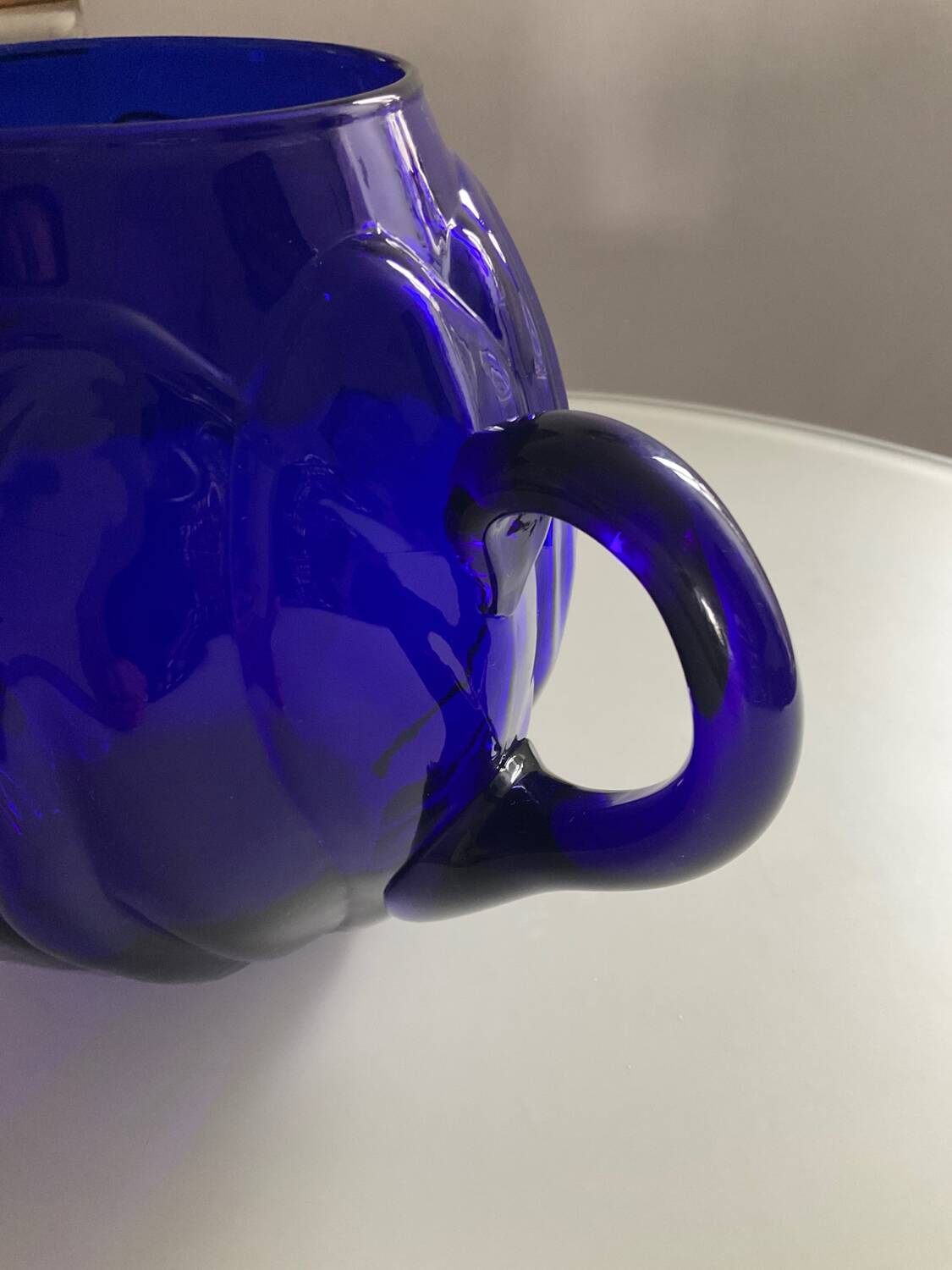 Vintage cobalt blue glass pitcher by Henry Dean
