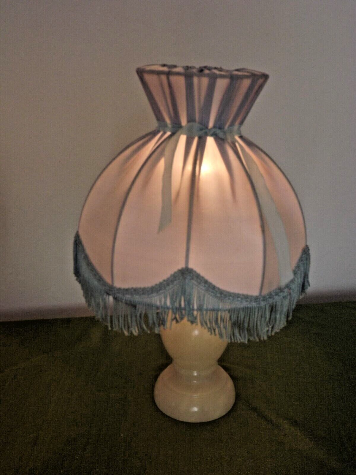 Pair of marble bedside lamps with blue satin fringed shades