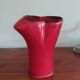 red ceramic designer vase by Les Grottes de Dieulefit