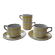 4 cups, 2 under cups yellow and white tea towel pattern