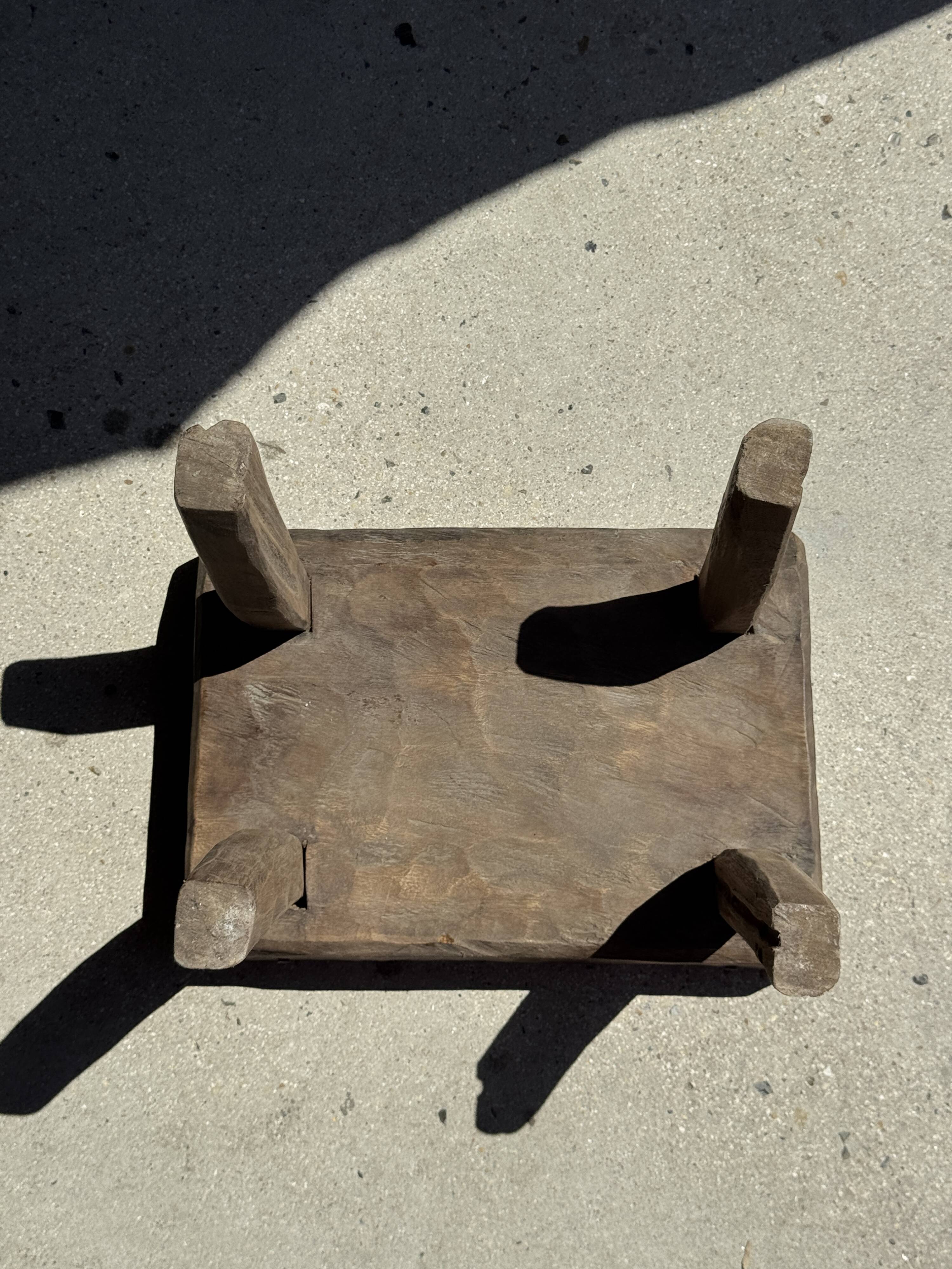 Small stool, rectangular solid teak side table with curved legs.