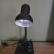 Black flexible desk lamp with built-in flashheld