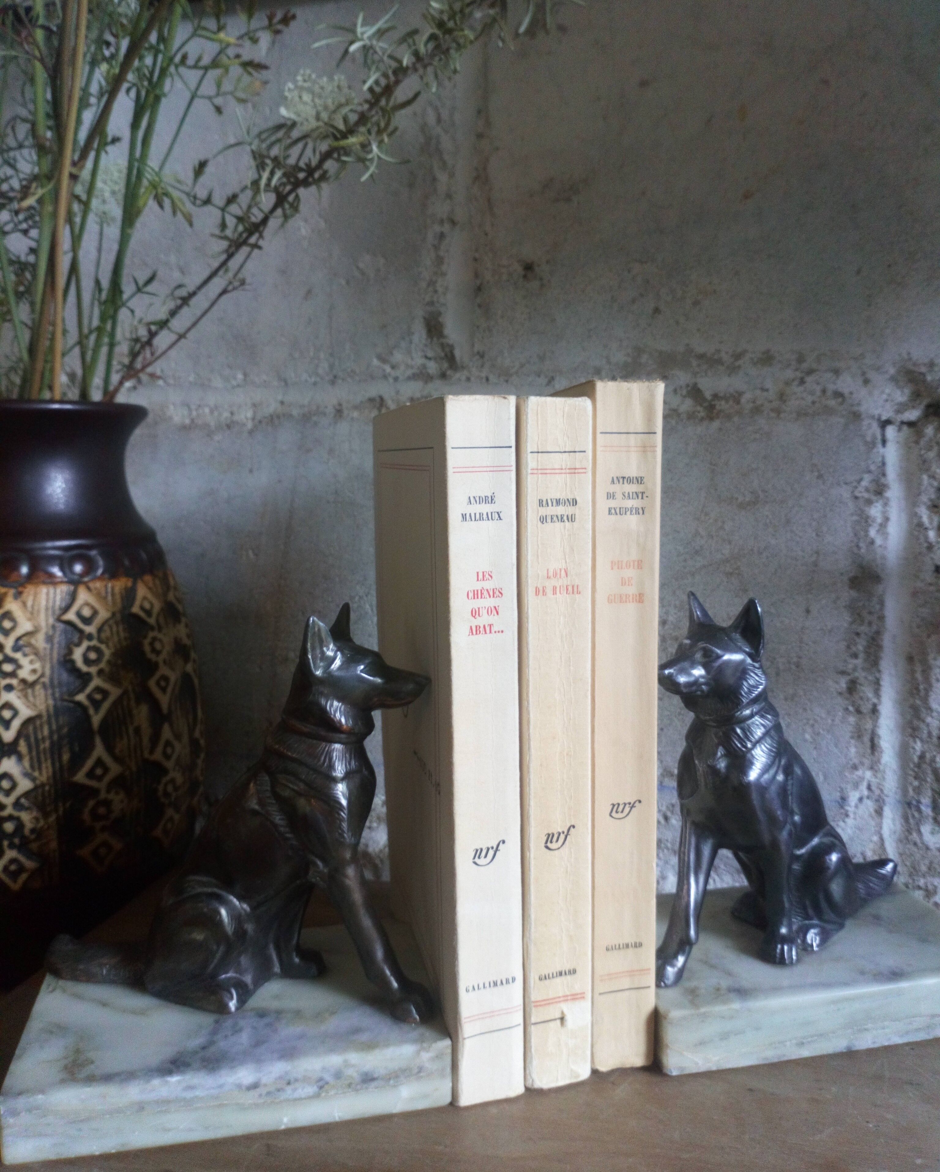 Pair of Art Deco bookends to signed wolf dogs