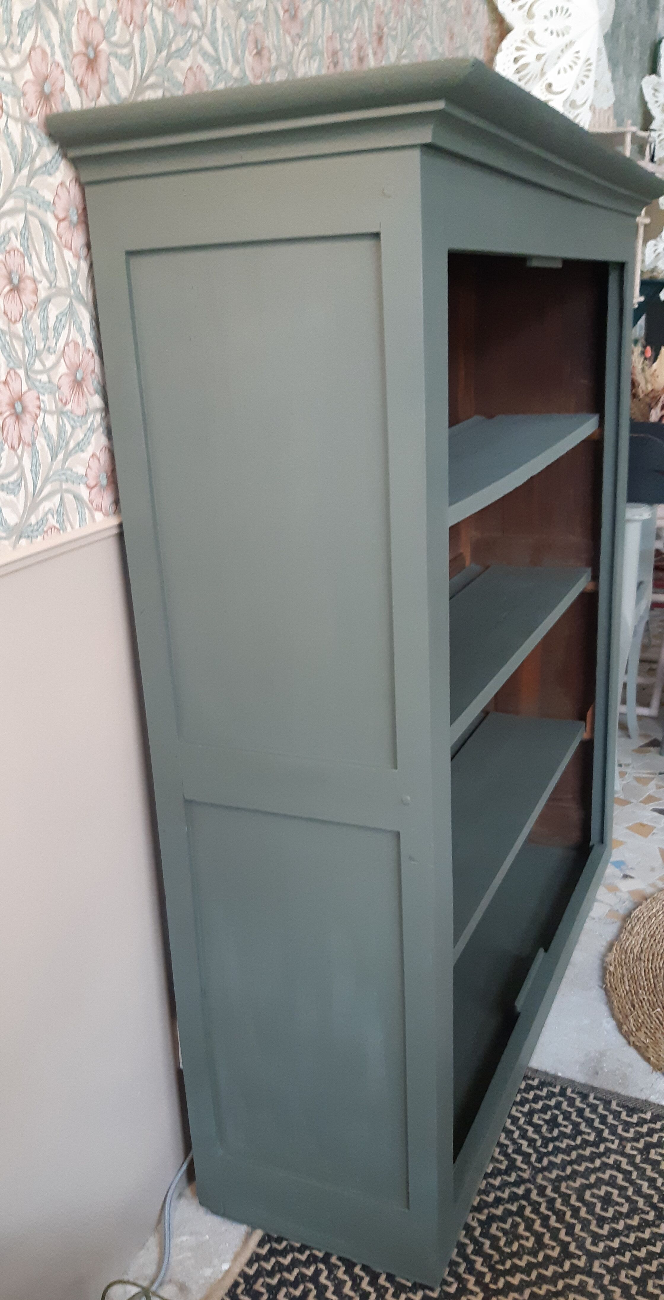 Wood and khaki green bookcase