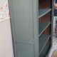 Wood and khaki green bookcase