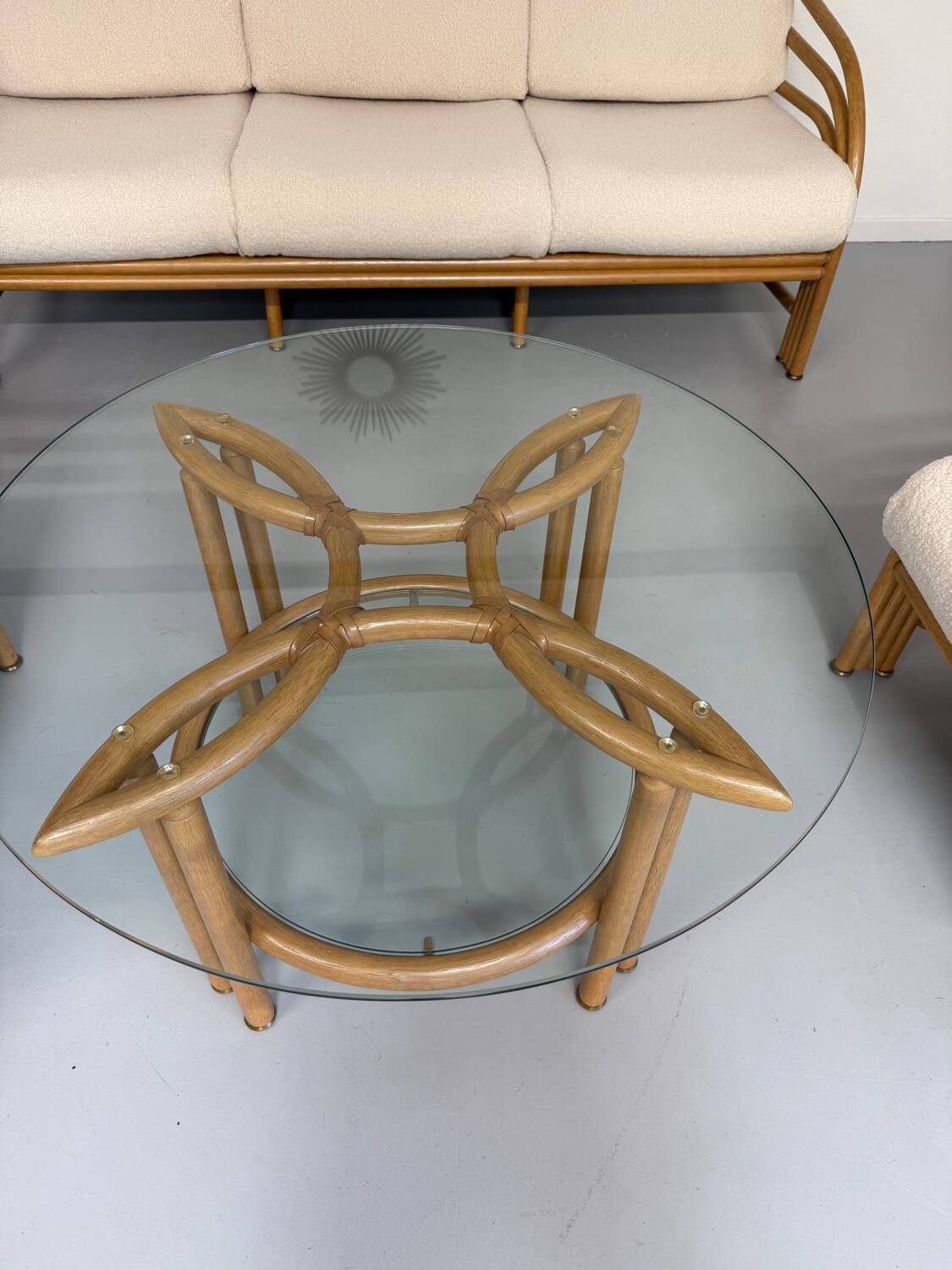 Complete living room with rattan sofa and white bouclette, brass finish, 80's design