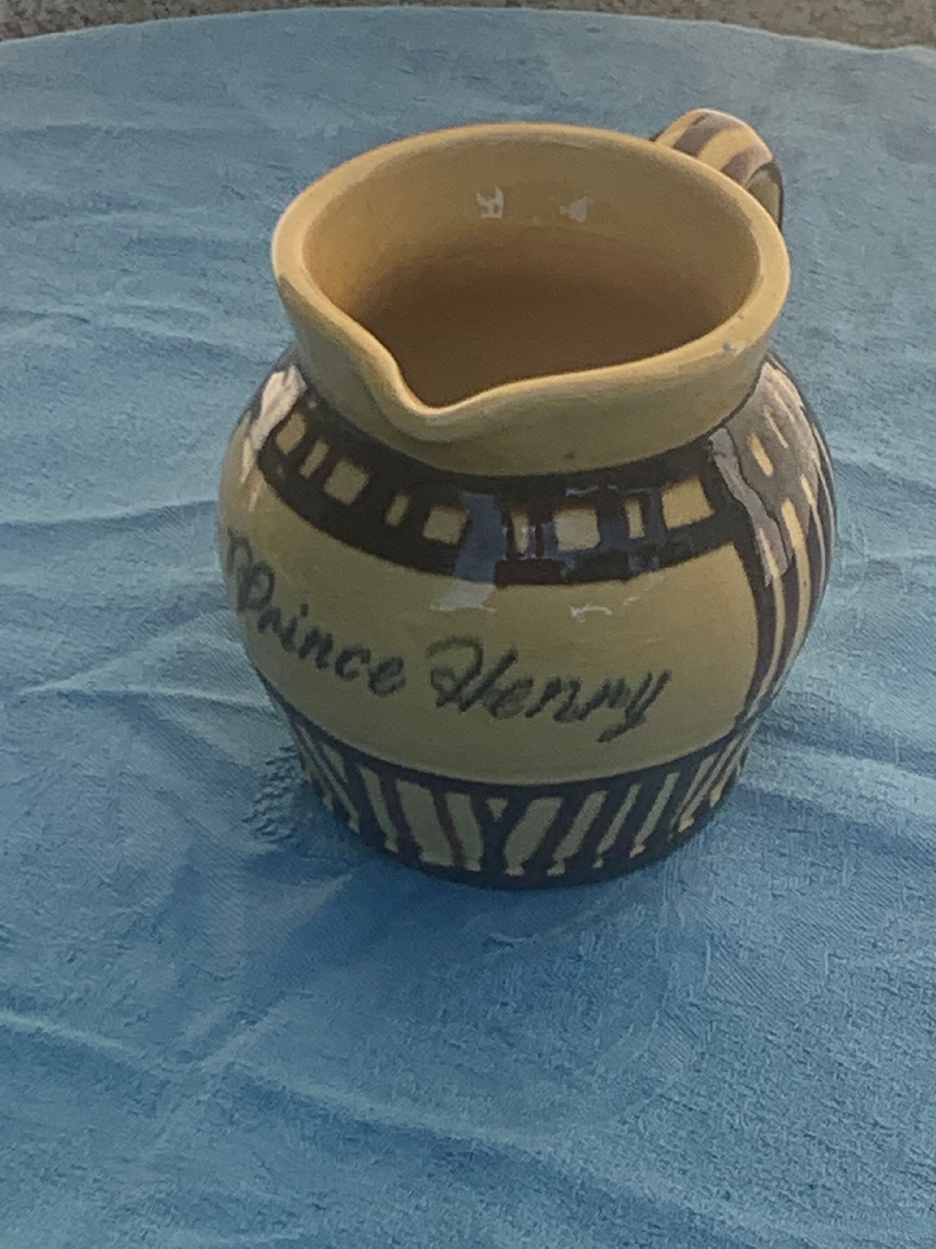 Vintage prince henry enamelled ceramic pitcher