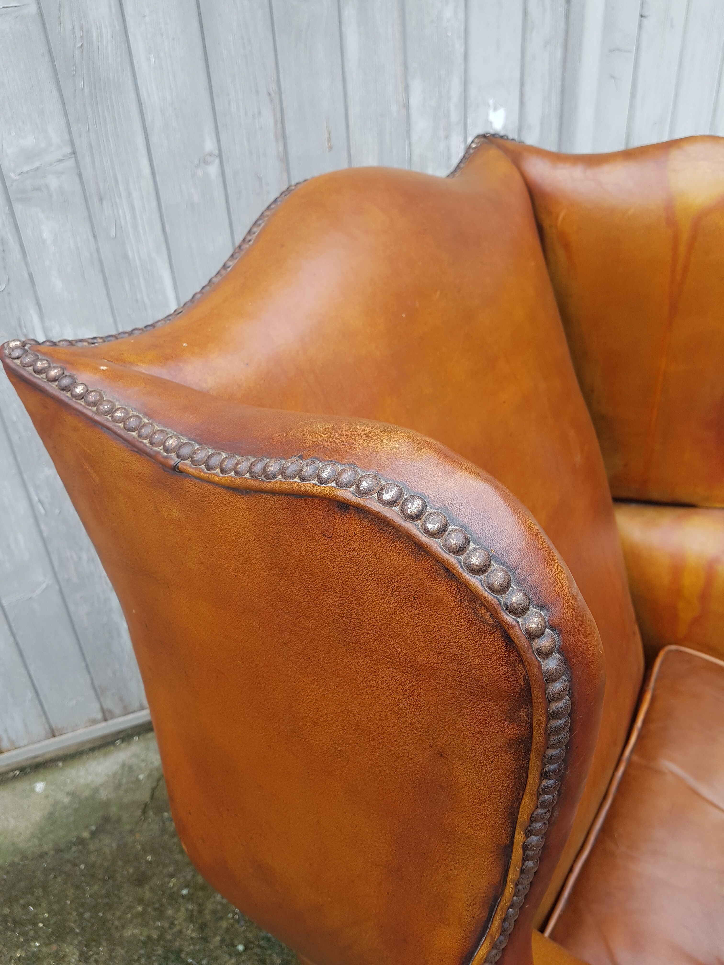 English fawn leather armchair with ears Chesterfield club
