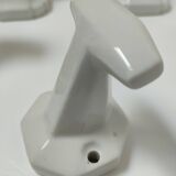 Five art deco white porcelain hooks