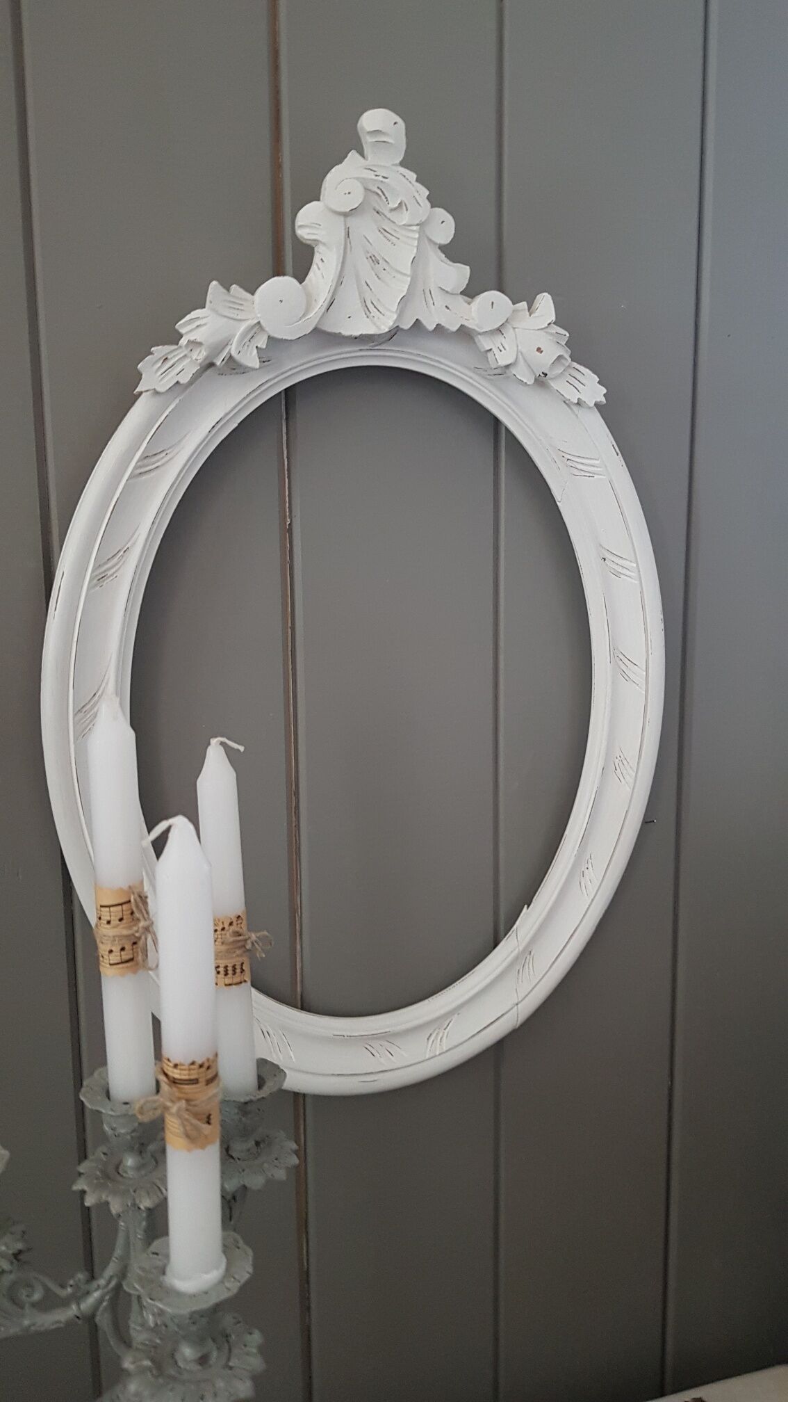 Old oval frame patinated white