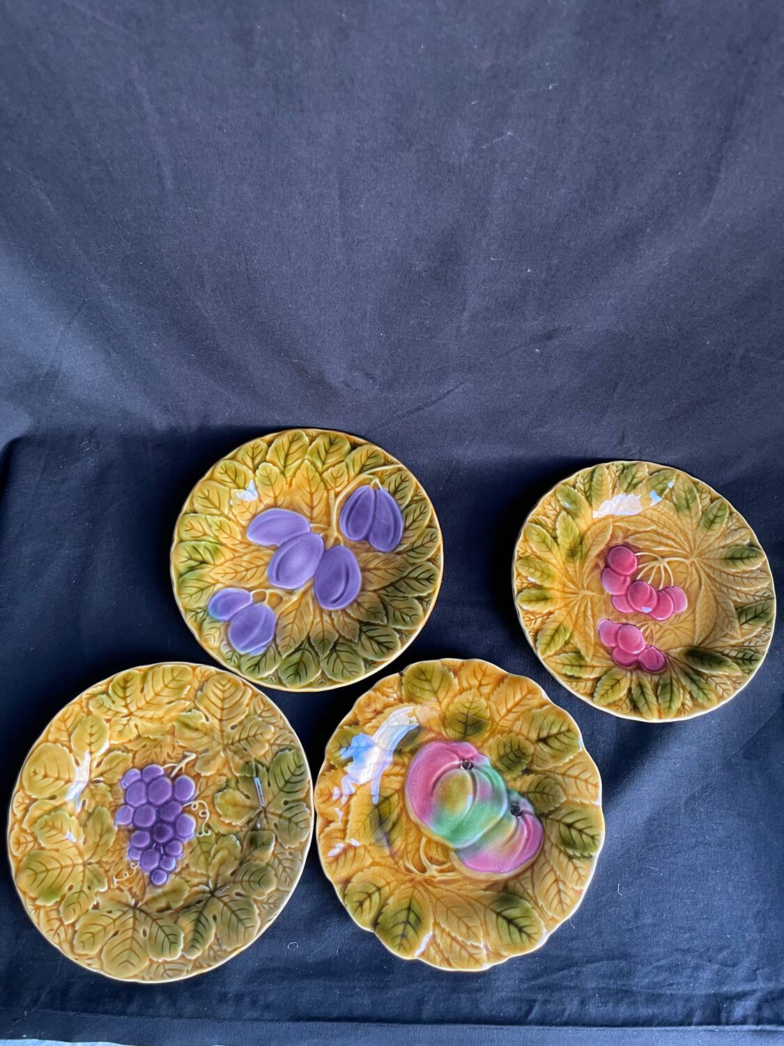 Set of four old Sarreguemines barbotine plates