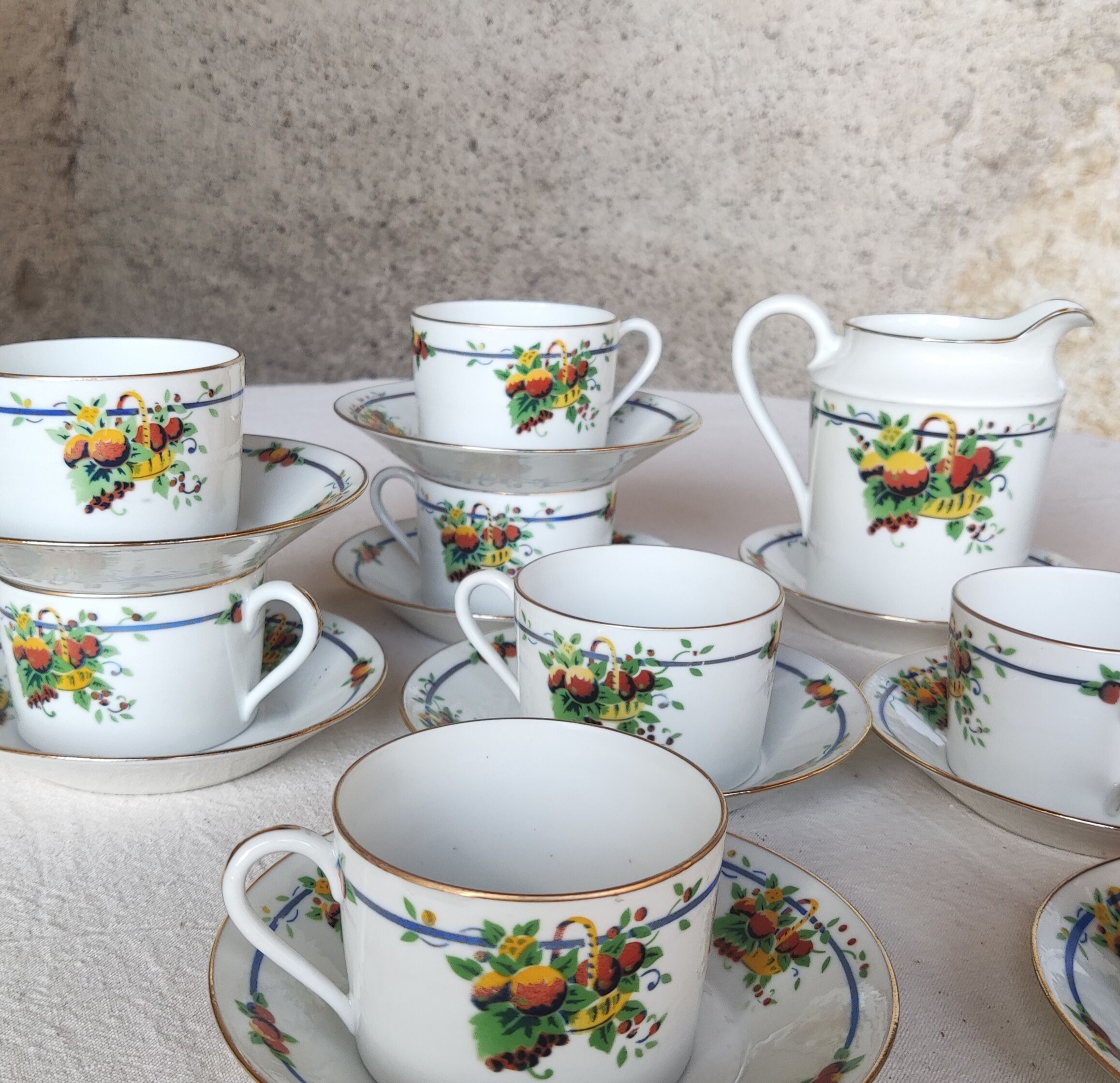 10 tea cups and creamer in Limoges porcelain