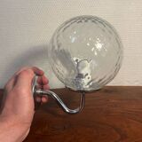 Delmas chrome wall light with chiseled glass globe