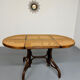 Vintage dining table with a cane top by Mundus from the 1970s.