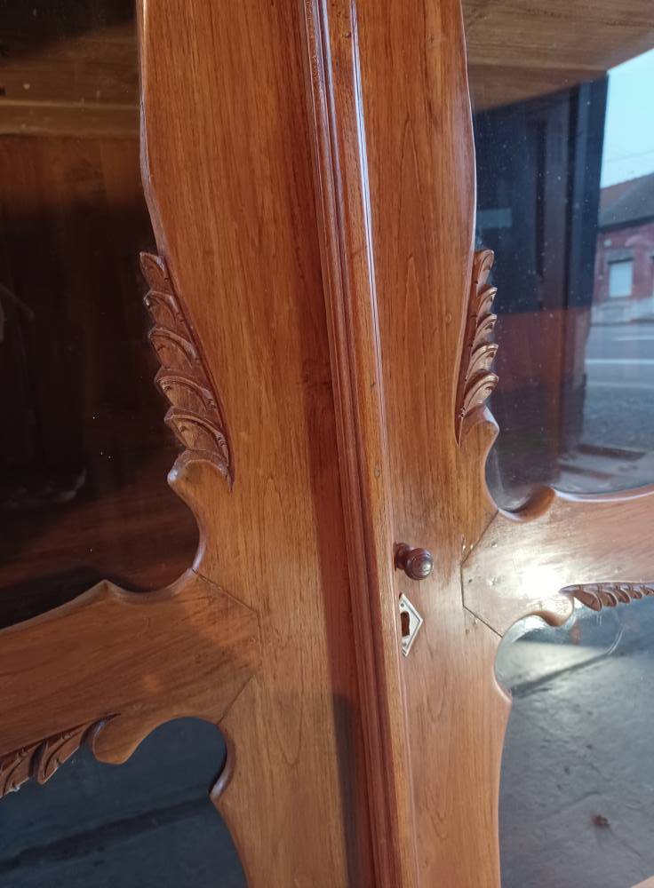 Large glass and carved cabinet
