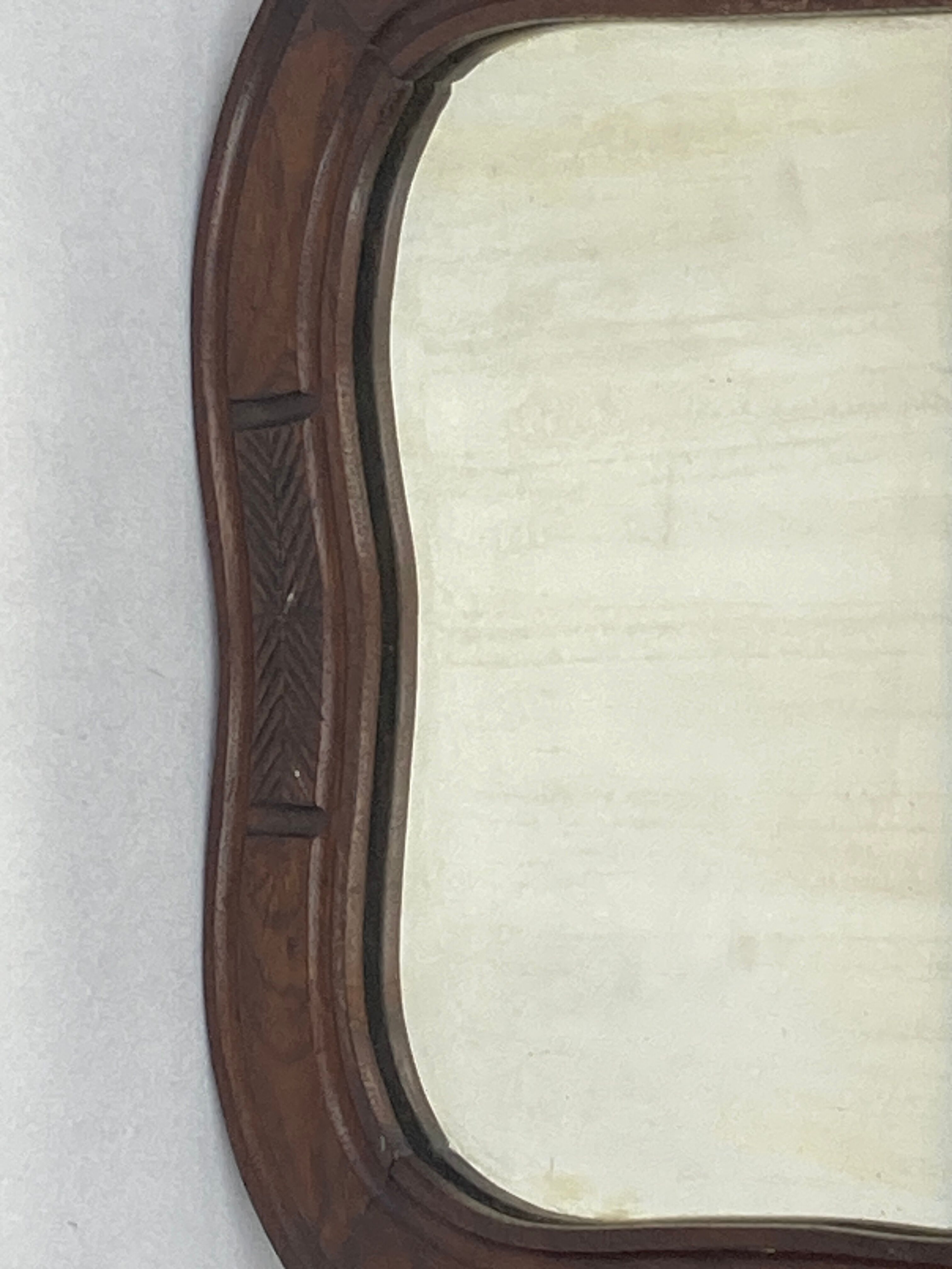 Hand carved wavy curvy vanity mirror, ca 1900