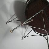 Armchair designed by Yuzuru Yamakawa  Metal frame.  Seat and back in braided rattan.