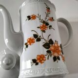 Vintage coffee pot Winterling Bavaria with orange floral decoration.