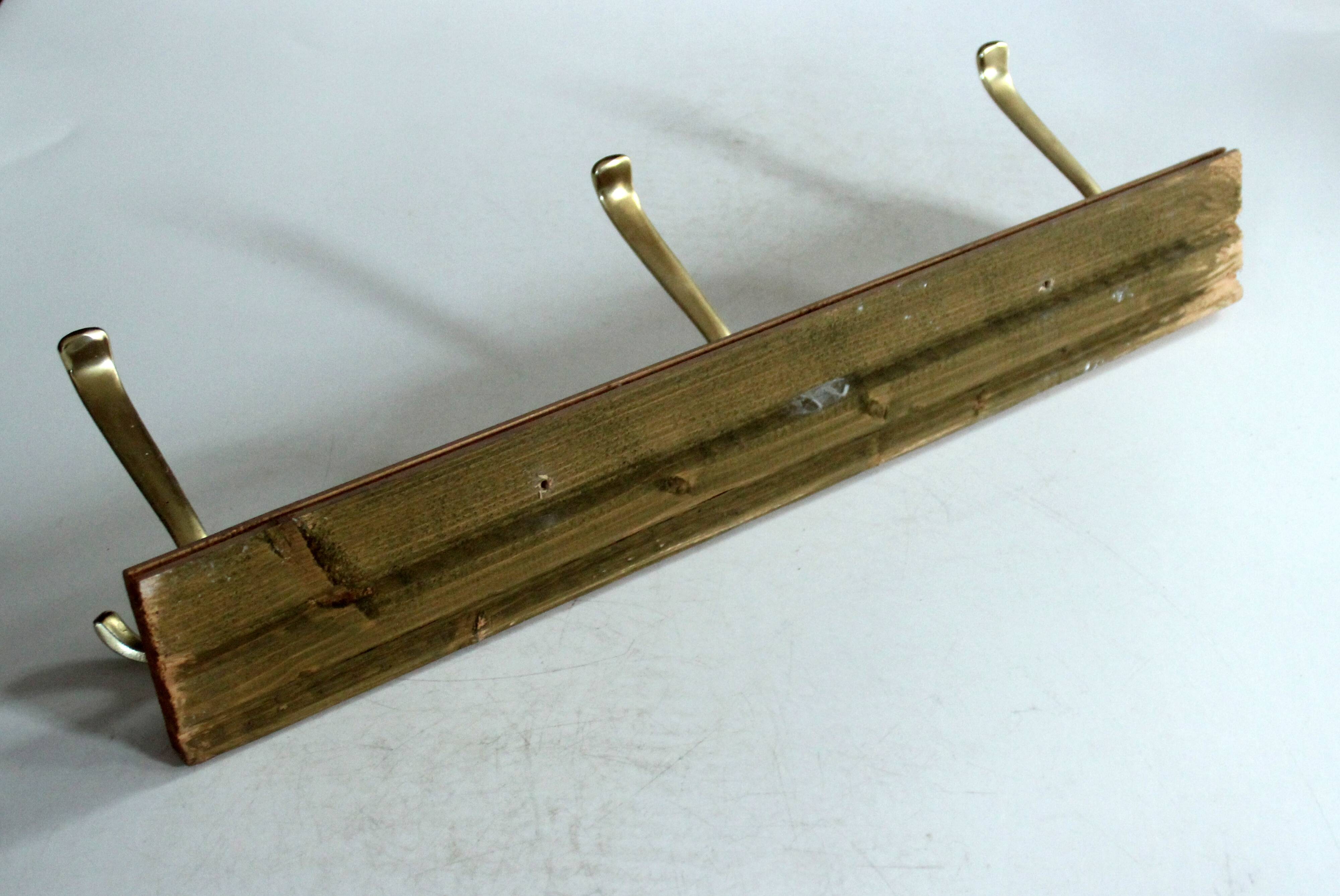 Wall mounted wooden coat rack with 3 brass hooks, vintage from the 50s