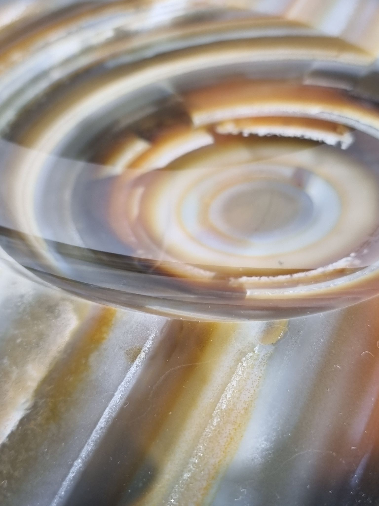Empty pocket, slice of brown ochre agate