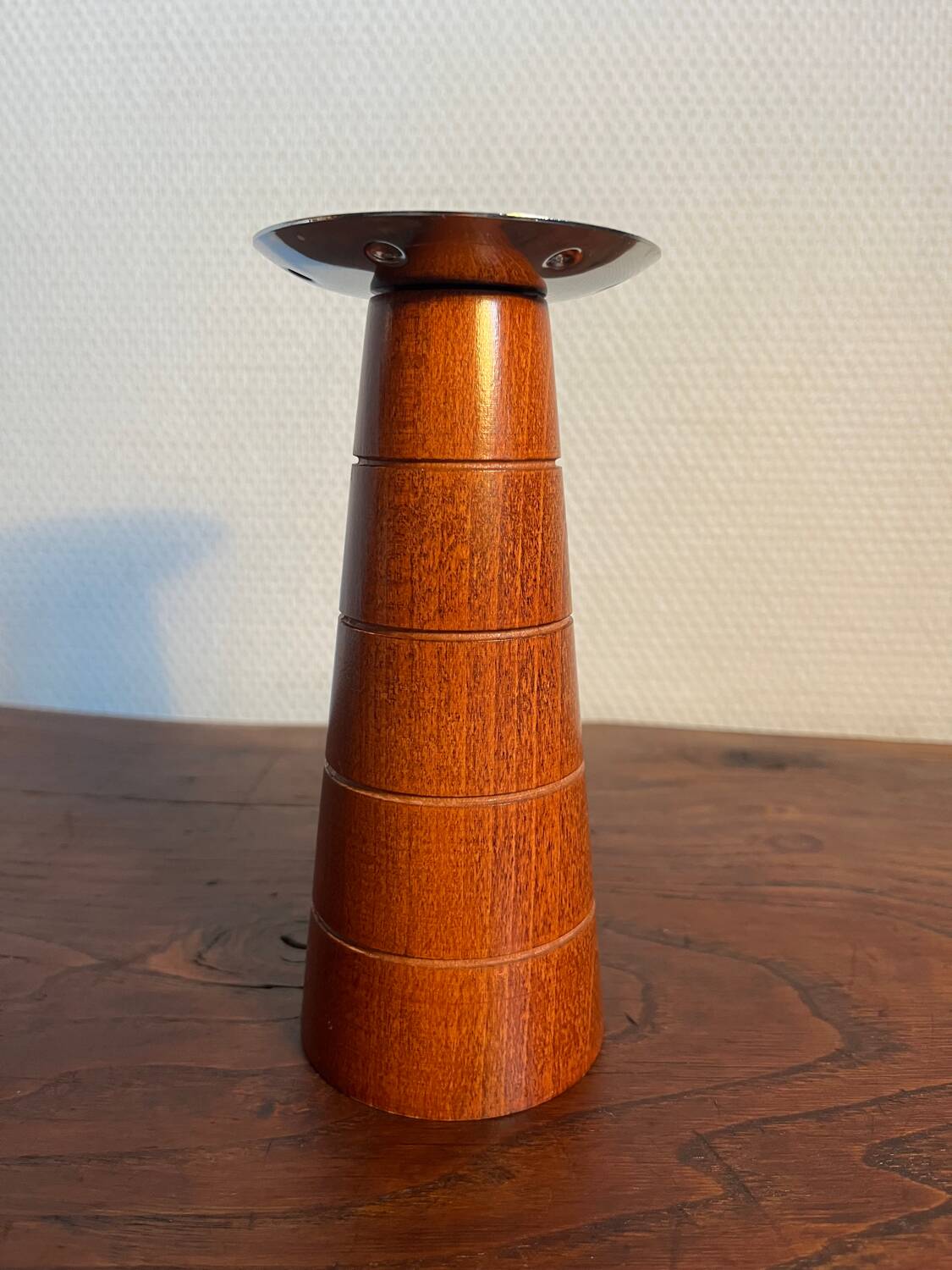 Pair of Guy Degrenne wooden and stainless steel candlesticks
