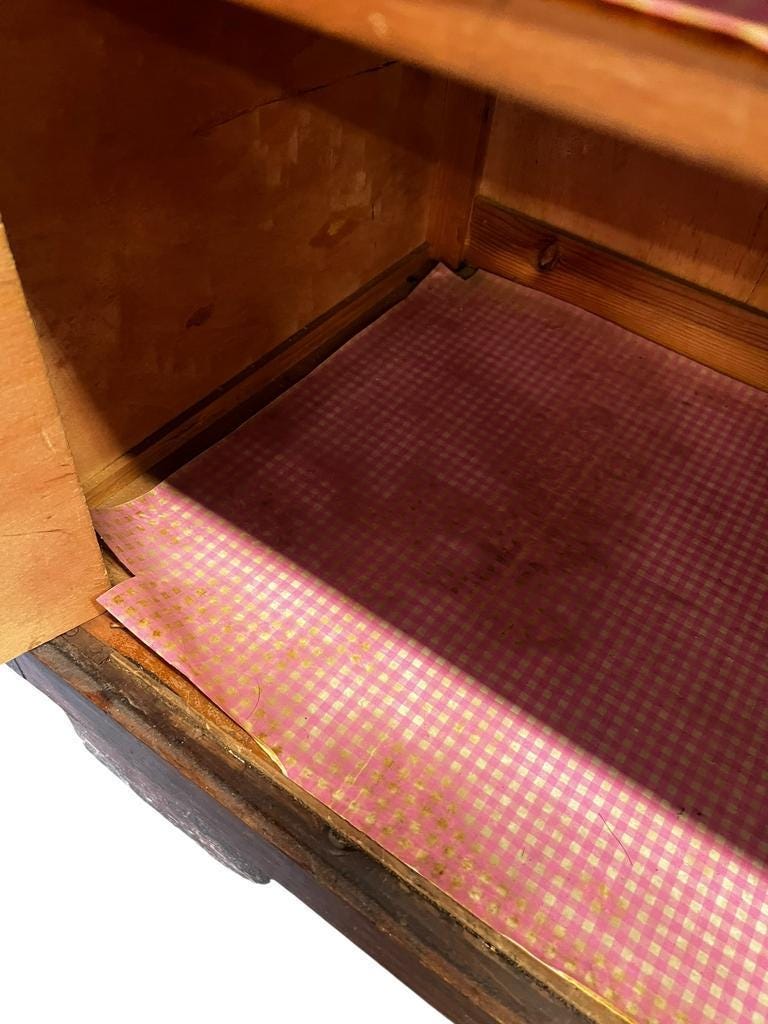 Vintage wooden display cabinet with yellow glass.