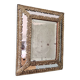 Mirror with repoussé brass frame, mercury glass, 19th century.