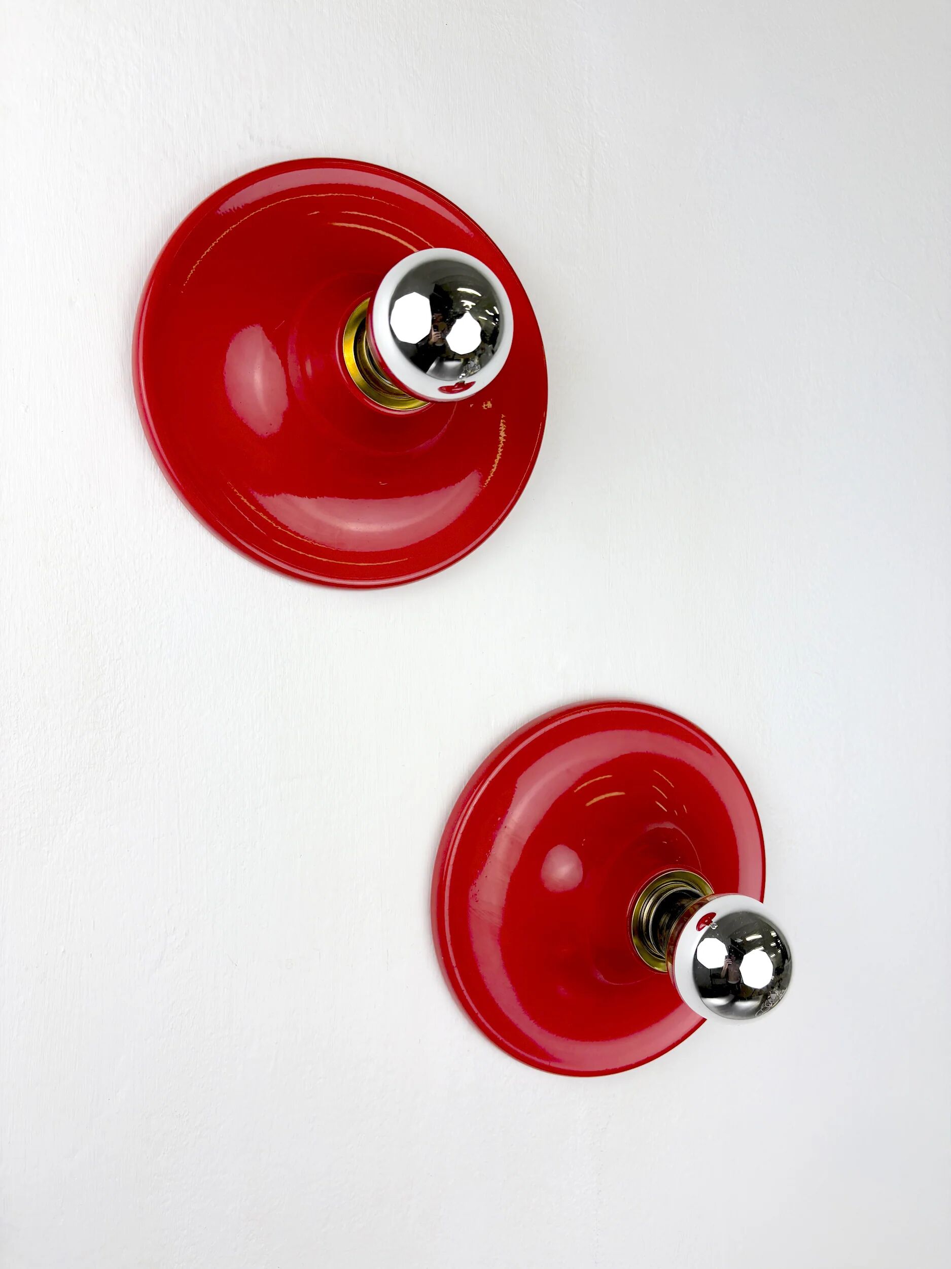 Pair of red Targetti Sankey sconces, 1970s, Italy