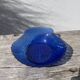 Blue glass shell emptier