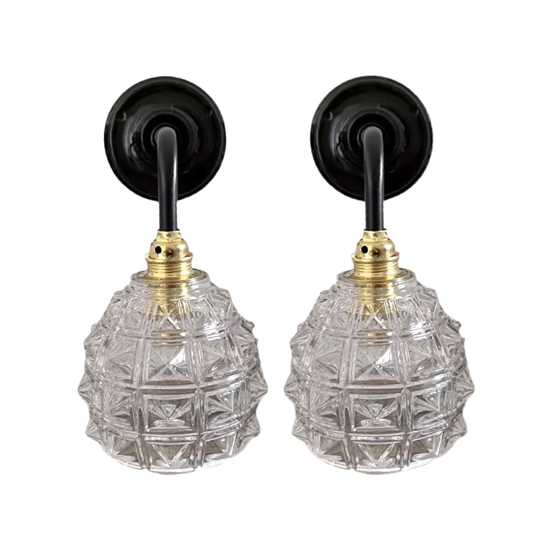 Set of two chiseled glass sconces