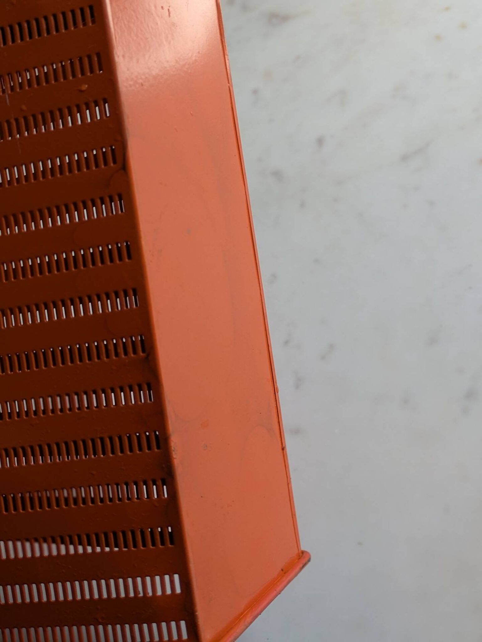 Vintage metal magazine rack in perforated orange/Mathieu Mategot style/70s